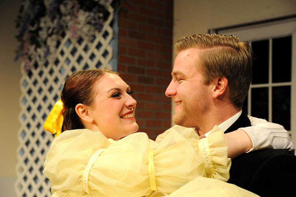 Cecily (Karli Reinbold) falls for the dashing Algernon (Kennan Miller) in “The Importance of Being Earnest.” (Larry T. Lisk)
