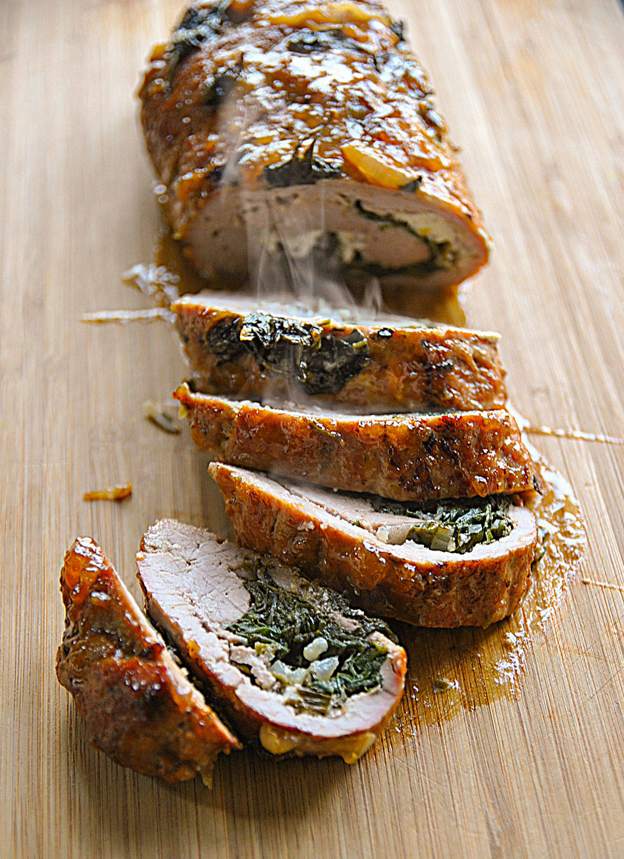 Pork loin stuffed with goat cheese and spinach is an elegant  and easy  weeknight meal. (Gretchen McKay / Post-Gazette)