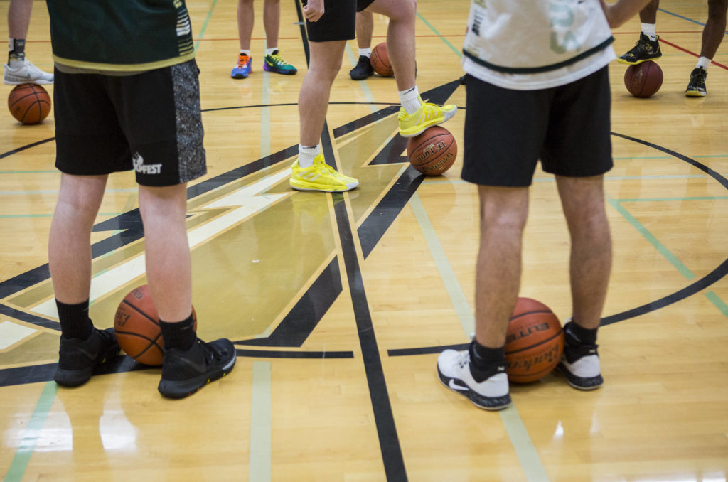 Players prepare for the start of practice on Wednesday, Feb. 26, 2020 in Marysville, Wash. (Olivia Vanni / The Herald)
