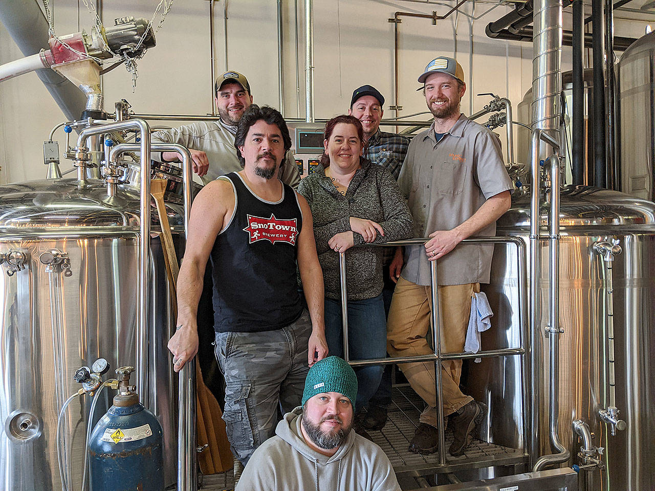 Snohomish brewers (from left) John Spada, Frank Sandoval, Greg Krsak, Elise Mattson, Bryant Castle and Adam Frantz during a brew session for the base beer for this year’s Smash Dash at Sound to Summit Brewing. (Aaron Swaney)