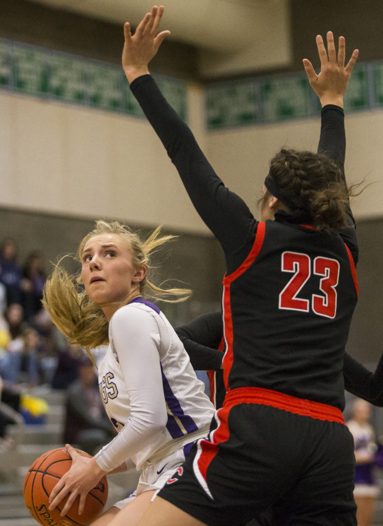 Lake Stevens’ Chloe Pattison looks for a shot while being guarded by Camas’ Jalena Carlisle during the game on Saturday, Feb. 29, 2020 in Shoreline, Wa. (Olivia Vanni / The Herald)
