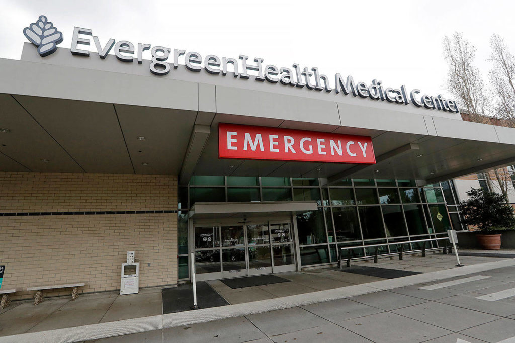 EvergreenHealth Medical Center is seen Saturday, where a person died of COVID-19, in Kirkland. State health officials announced the death Saturday, marking the first such reported death in the United States. (AP Photo/Elaine Thompson)
