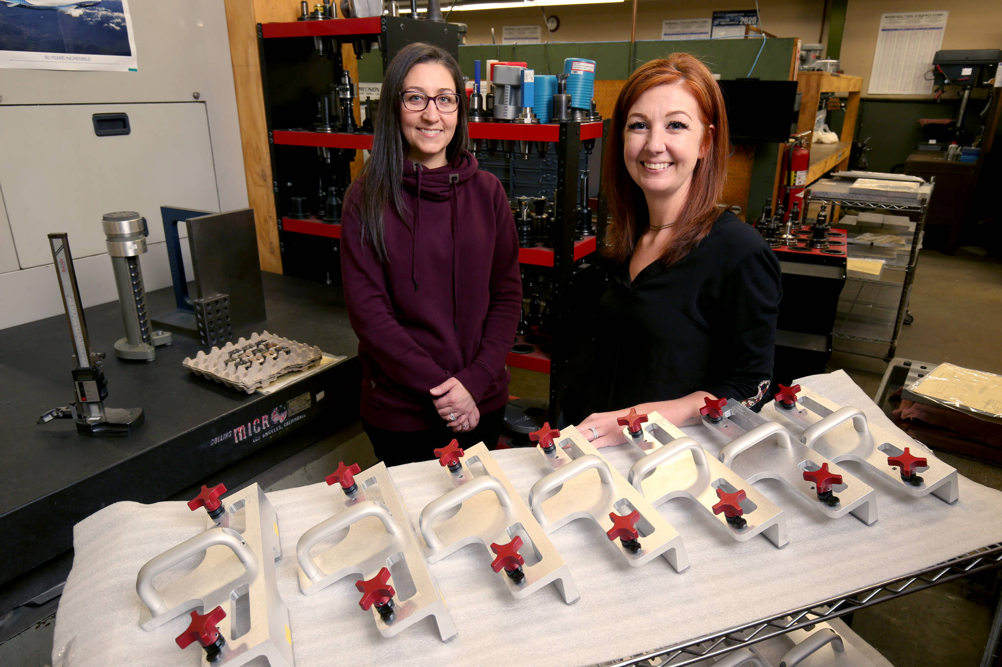 New Tech Industries is an aerospace supplier in Mukilteo owned and operated by three women, Carmen Evans, right, who co-owns the company with her sister Gina Morken, left, and their mother. They make tools, such as specialty wrenches and jigs, that are used to build aircraft. (Andy Bronson / The Herald)