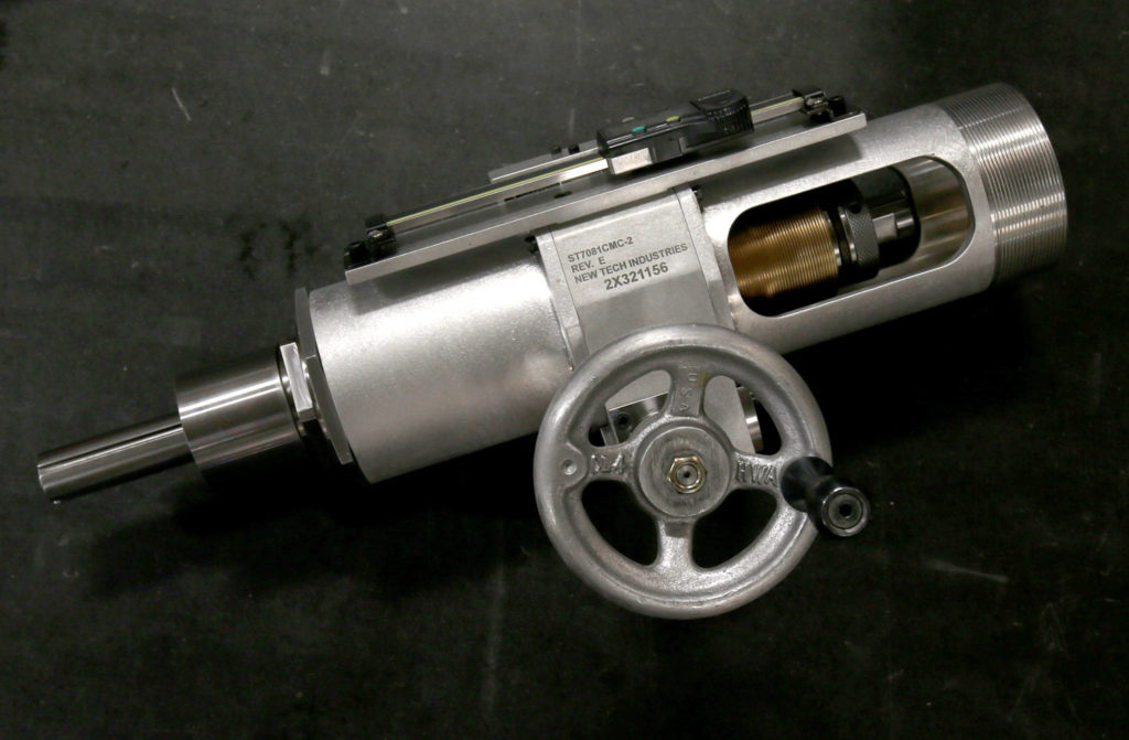 A hand feed assembly built by New Tech Industries, an aerospace supplier in Mukilteo owned and operated by Carmen Evans who co-owns the company with her sister Gina Morken and their mother. They make tools, such as specialty wrenches and jigs, that are used to build aircraft. (Andy Bronson / The Herald)

