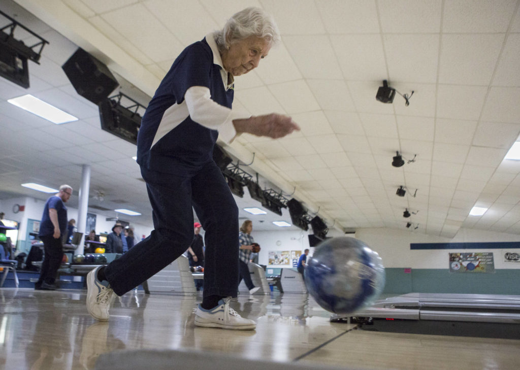 Carol Perry bowls during league bowling. (Olivia Vanni / The Herald)
