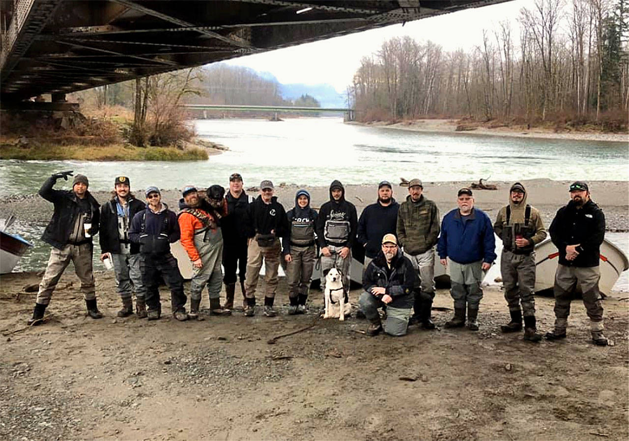 In drift boats and boats called sleds, members of the Sky River Anglers cleaned up the Skykomish River banks between Sultan and Monroe on March 1. (Matthew Kennedy)