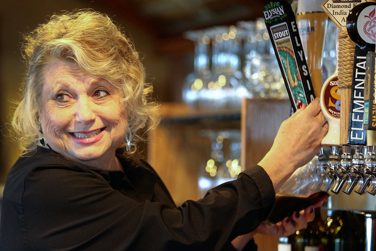 Nancy Myrtle has worked the bar at Arnies Pacific Northwest Favorites of Mukilteo for more than 30 years. (Kevin Clark / The Herald)