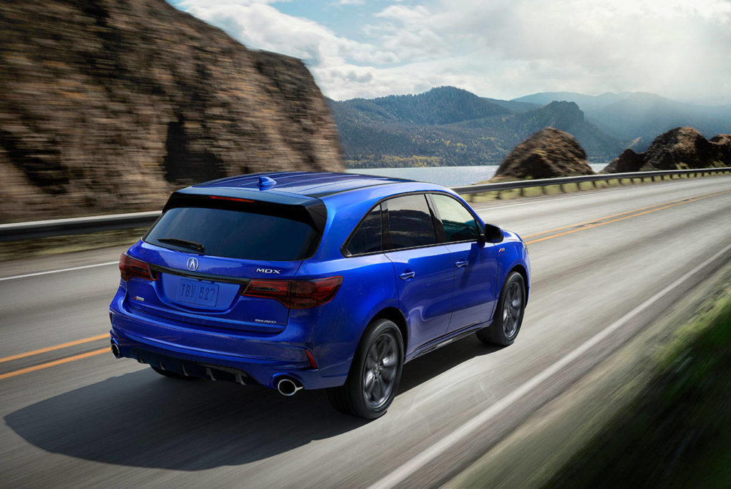 The 2020 Acura MDX A-Spec model has large-diameter exhaust tips and dark chrome trim for the tailgate spoiler. (Manufacturer photo)
