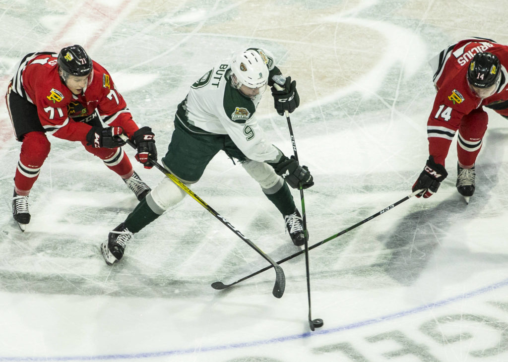 Silvertips’ Dawson Butt fights for the puck during the game against the Portland Winterhawks on Sunday, March 1, 2020 in Everett, Wa. (Olivia Vanni / The Herald)
