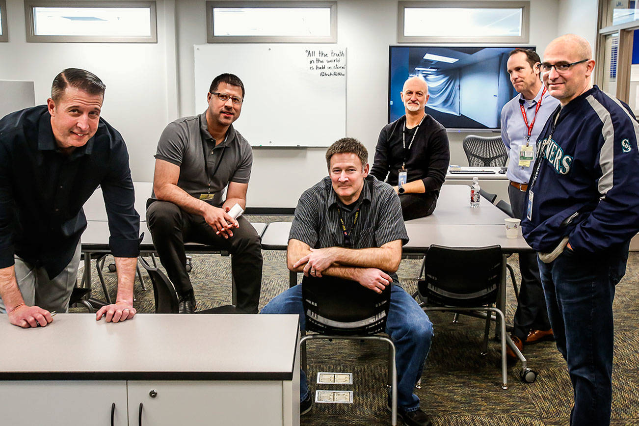 Gathered in a new classroom at the Denney Juvenile Justice Center, which was created to help enrich young lives, are from left, Jeff Atkins, Jaime Fajardo, Ross Krueger, Kevin Crittenden, Mike Irons and Calvin Nichols. (Dan Bates / The Herald)