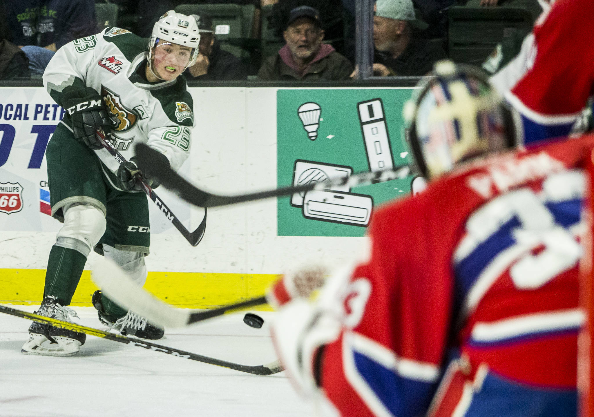 Everett Silvertips defenseman Jake Christiansen takes a shot on goal during a game against Spokane on Jan. 26 in Everett. (Olivia Vanni / The Herald)