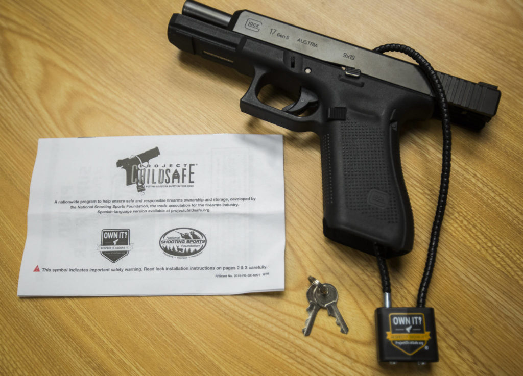 The Project ChildSafe gun lock comes with an instruction manual and keys. (Olivia Vanni / The Herald)
