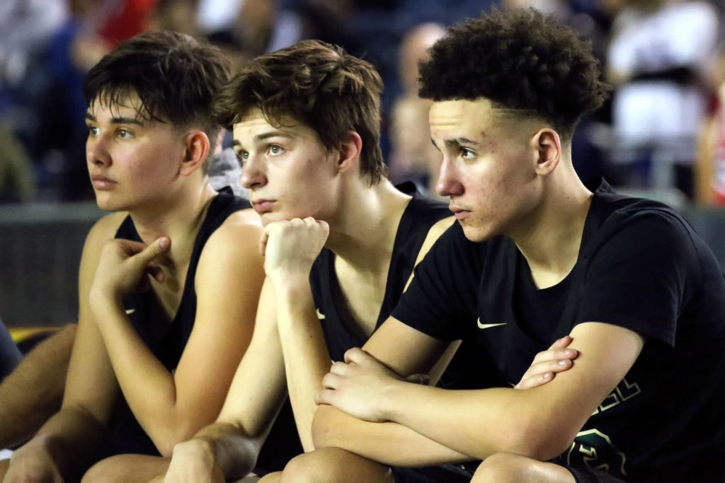 Members of Marysville-Getchell await the close of the game Wednesday morning at the Tacoma Dome on March 4, 2020. Marysville-Gethchell lost to Wilson 73-52. (Kevin Clark / The Herald)
