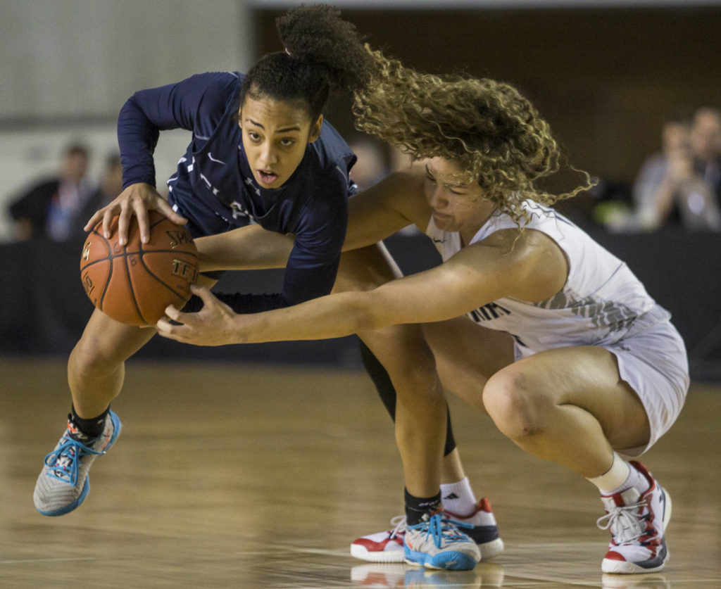 Glacier Peak’s Aaliyah Collins (left) steals the ball from Chiawana’s Talia VonOelhoffen during a 4A girls Hardwood Classic quarterfinal on Thursday in Tacoma. (Olivia Vanni / The Herald)
