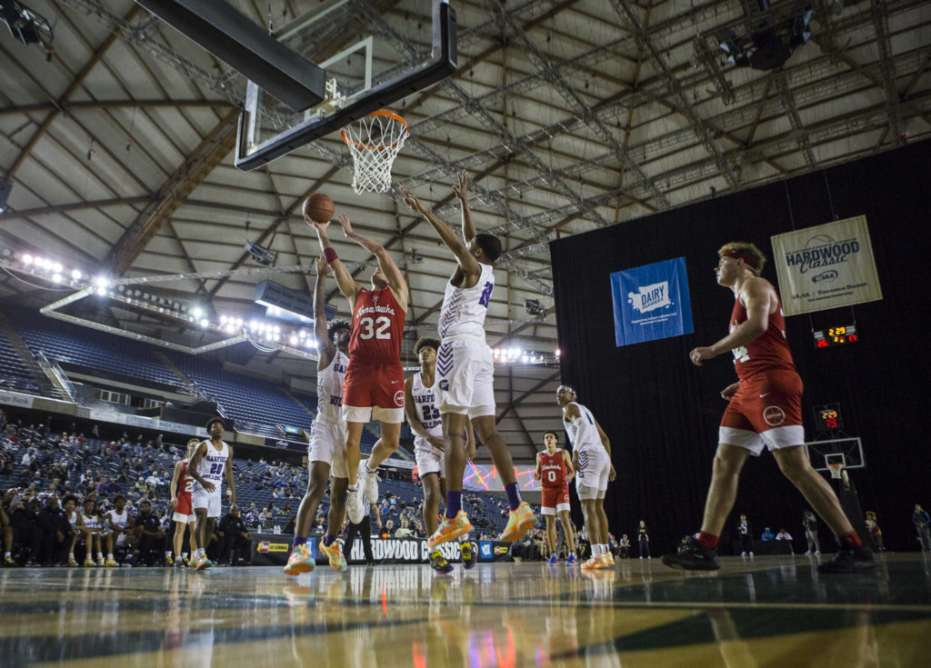 Marysville Pilchuck’s Aaron Kalab makes a layup during a 3A boys Hardwood Classic quarterfinal against Garfield on Thursday in Tacoma. (Olivia Vanni / The Herald)

