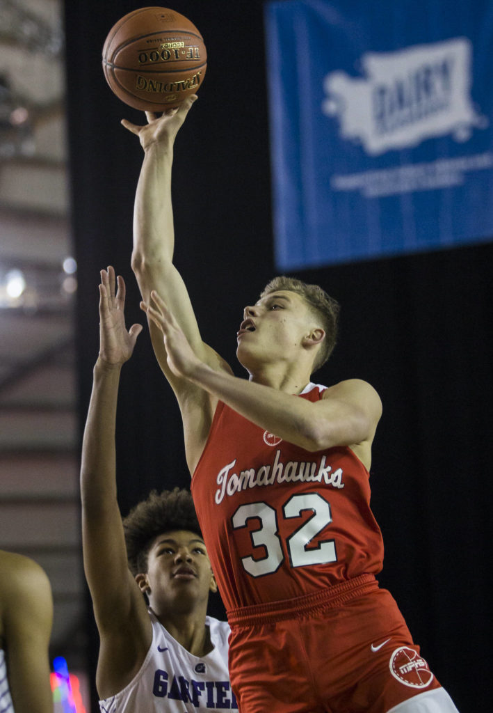 Marysville Pilchuck’s Aaron Kalab makes a jump shot during a 3A boys Hardwood Classic quarterfinal against Garfield on Thursday in Tacoma. (Olivia Vanni / The Herald)
