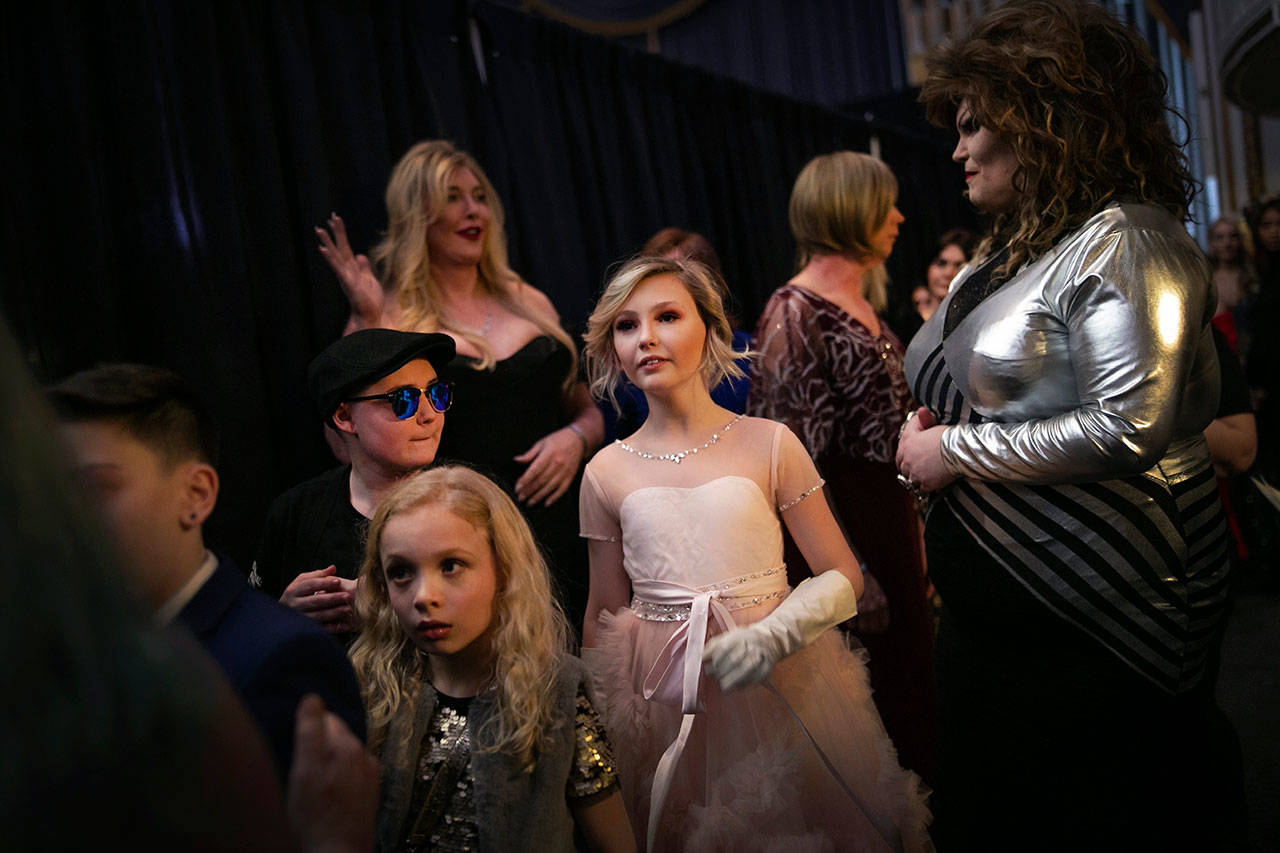 Asher, 12 (center), waits backstage to walk down the runway with others during a fashion show held by the Trans Club of New England on Jan. 31 on Boston. (AP Photo/Wong Maye-E)