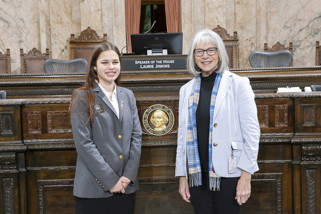 Page Clara Nichols poses with Rep. Norma Smith.
