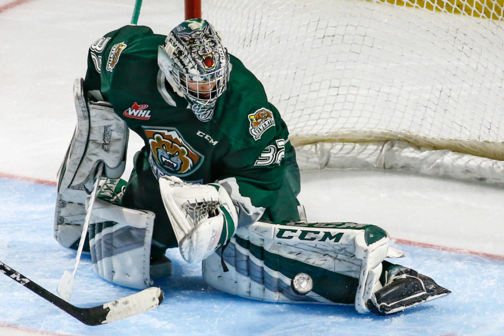 Everett’s Dustin Wolf stops a shot at goal against Seattle Sunday evening at ShoWare Center in Kent on March 8, 2020. The Silvertips won 3-2. (Kevin Clark / The Herald)
