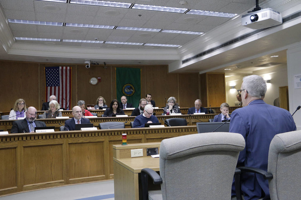 Washington Secretary of Health John Wiesman (right) gives a coronavirus update to lawmakers on the Senate Ways and Means Committee on March 2 in Olympia. (AP Photo/Rachel La Corte)
