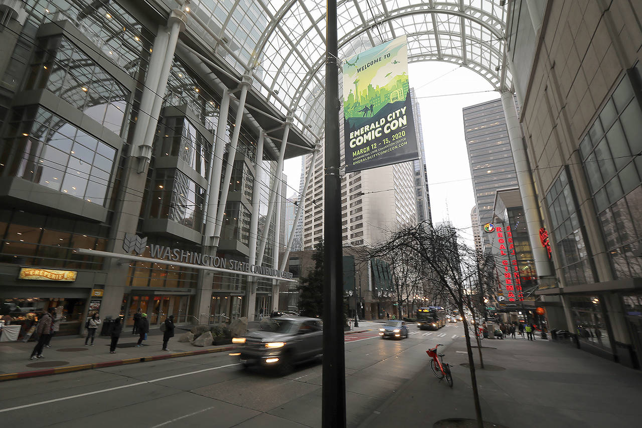 In this March 6 photo, a sign at the Washington State Convention Center in downtown Seattle promotes the Emerald City Comic Con, which has been postponed over worries and uncertainty about the COVID-19 coronavirus. (AP Photo/Ted S. Warren)
