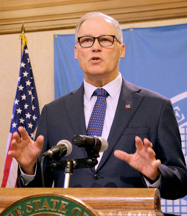 Washington Gov. Jay Inslee talks to the media Tuesday in Olympia. (AP Photo/Rachel La Corte)