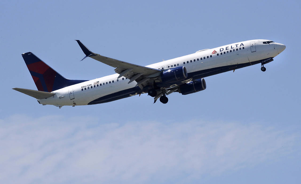 In this 2018 photo, a Delta Air Lines passenger jet plane, a Boeing 737-900 model, approaches Logan Airport in Boston. (AP Photo/Charles Krupa, File)