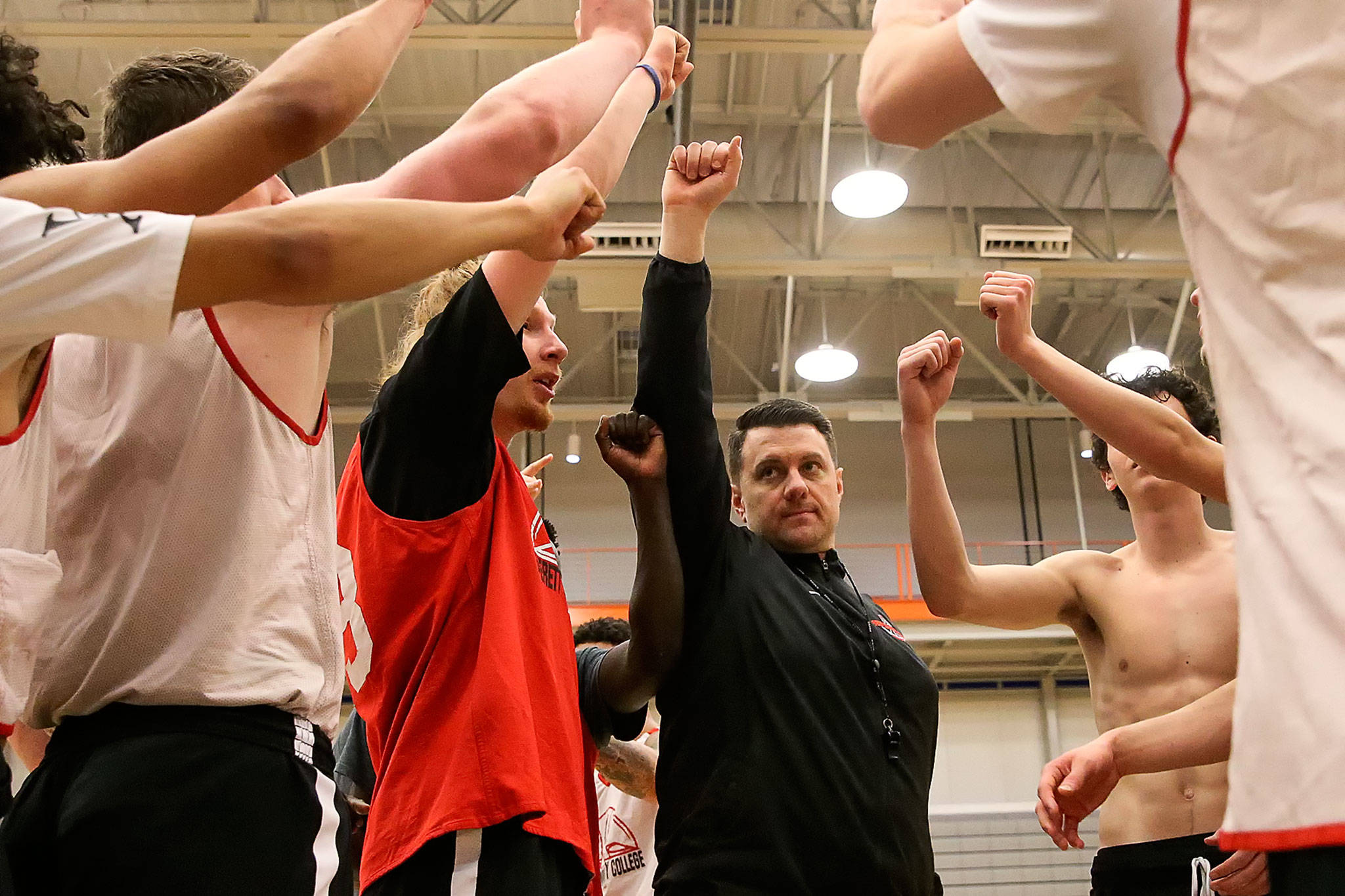 Everett Community College men’s basketball coach Mike Trautman gathers his team at the end of practice on March 2 in Everett. (Kevin Clark / The Herald)