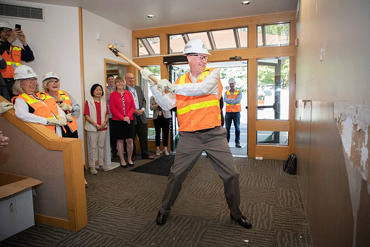 Rich Bloch, a Snohomish resident and chairman of the Northwest Kidney Centers board, uses a sledgehammer at the Lake Washington Kidney Center to signal the start of renovations last year. Bloch might wield the hammer again for a new Everett Kidney Center set to open later this year. After 1½ years on dialysis, Bloch received a kidney transplant in 2013. (Northwest Kidney Centers)