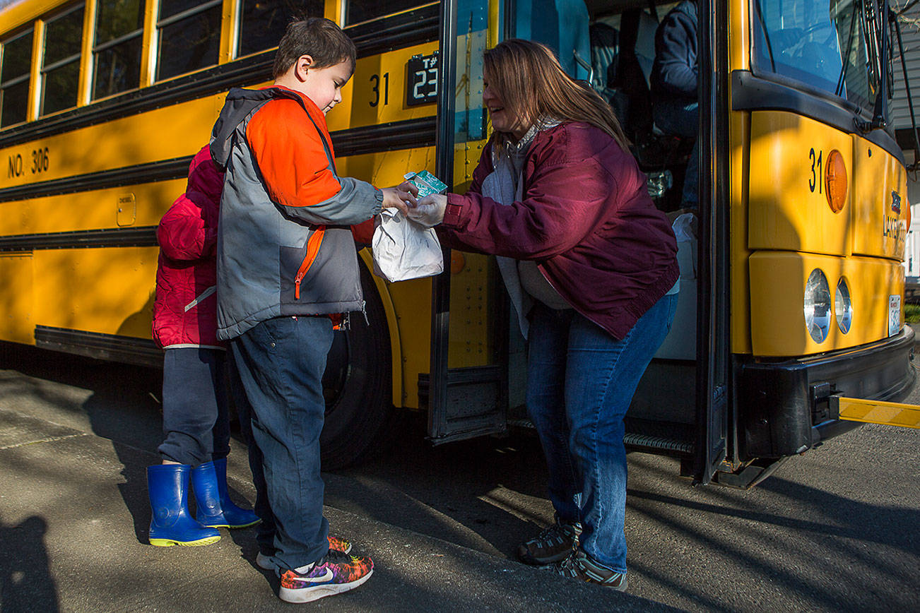 Staffers deliver more meals every day to kids out of school