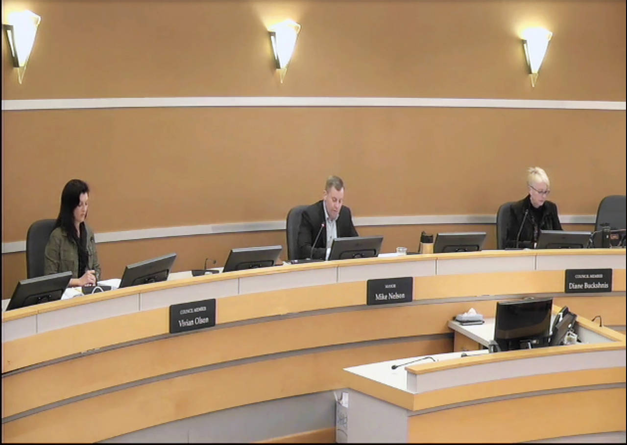 Council member Vivian Olson (left), Mayor Mike Nelson (center) and council member Diane Buckshnis practiced social distancing at the Edmonds City Council meeting Tuesday. (City of Edmonds)
