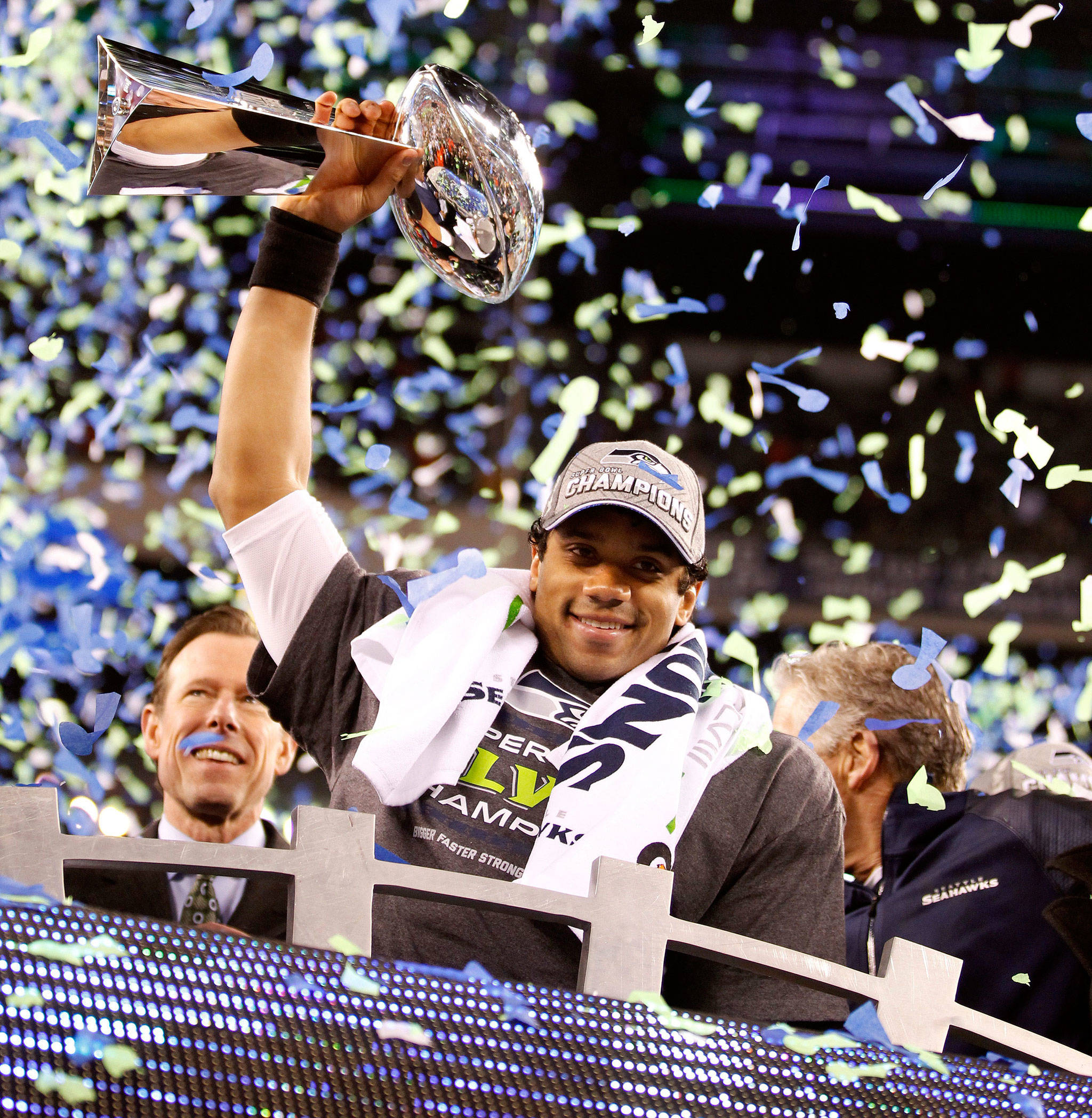 Seahawks quarterback Russell Wilson holds the Vince Lombardi Trophy following Seattle’s win over the Broncos in Super Bowl XLVIII in 2014 in New York. (Jennifer Buchanan / The Herald)