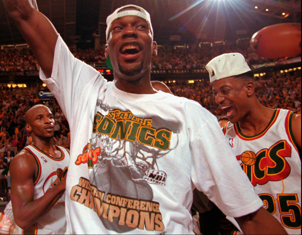 The SuperSonics’ Shawn Kemp celebrates with teammates after Seattle’s victory over the Jazz in Game 7 of the Western Conference Finals in 1996. (AP Photo/Elaine Thompson)
