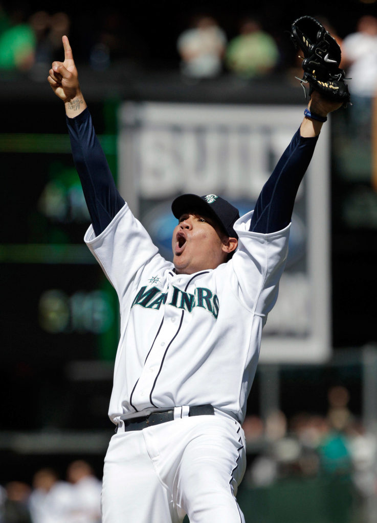Mariners pitcher Felix Hernandez reacts after throwing a perfect game against the Rays in 2012 in Seattle. (AP Photo/Ted S. Warren)

