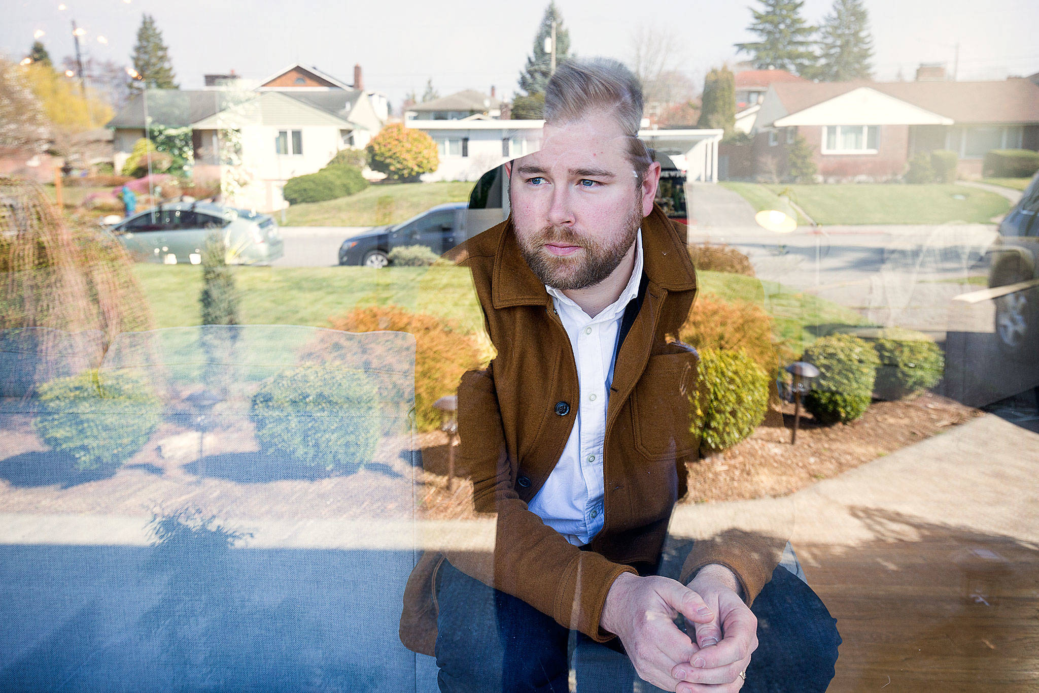 Tyler Chism, seen here Friday, was diagnosed with COVID-19 earlier in March and is currently cleared, by CDC standards. But the 33-year-old City of Everett employee and musician chooses to remain indoors at home in Everett. (Andy Bronson / The Herald)