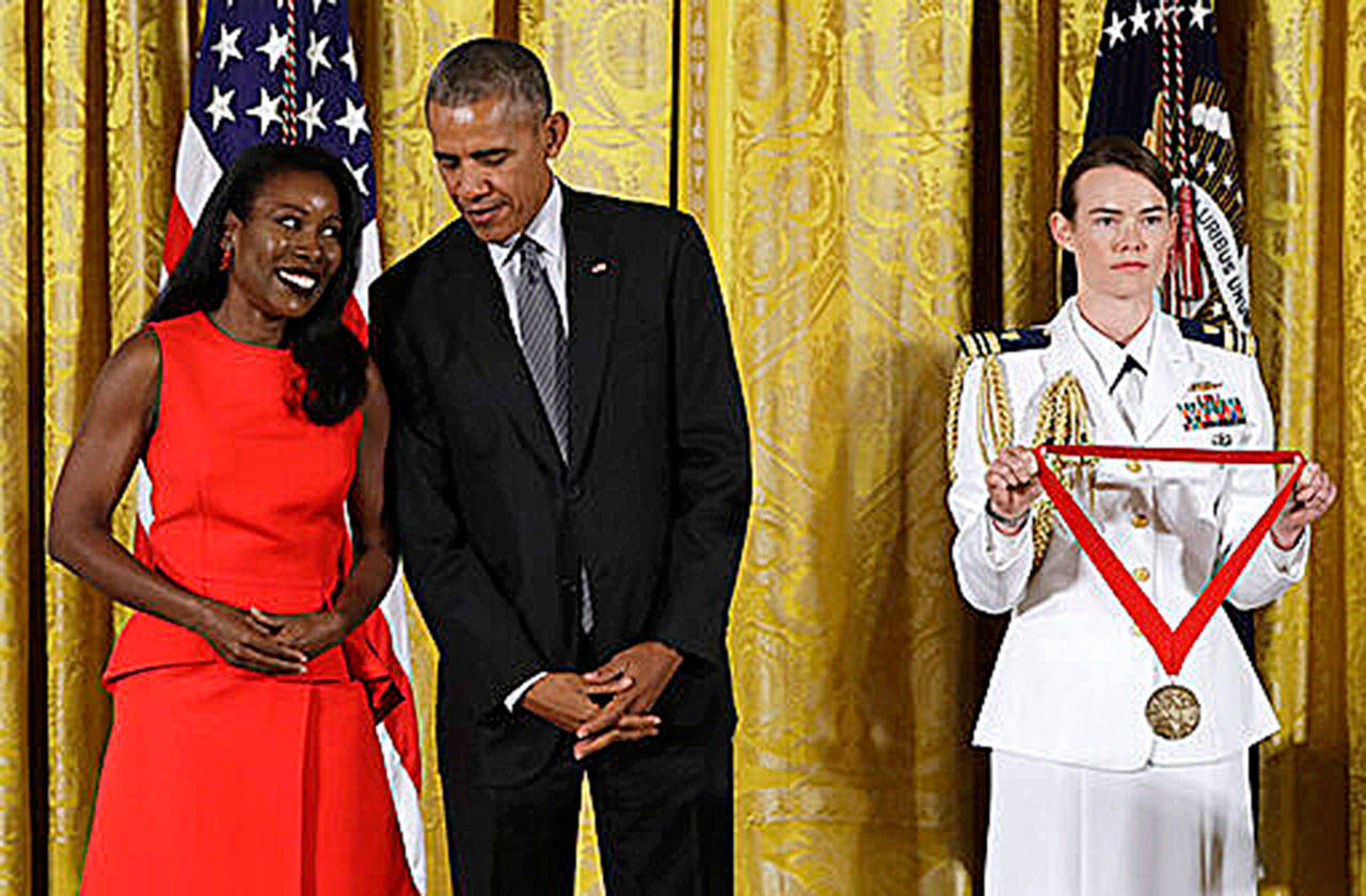 President Barack Obama awards journalist and author, Isabel Wilkerson, the 2015 National Humanities Medal during a 2016 ceremony at the White House. Wilkerson’s new book, her first since “The Warmth of Other Suns,” takes on what she is calling the country’s caste system. The years-long project is called “Caste” and comes out Aug. 20. (Associated Press)