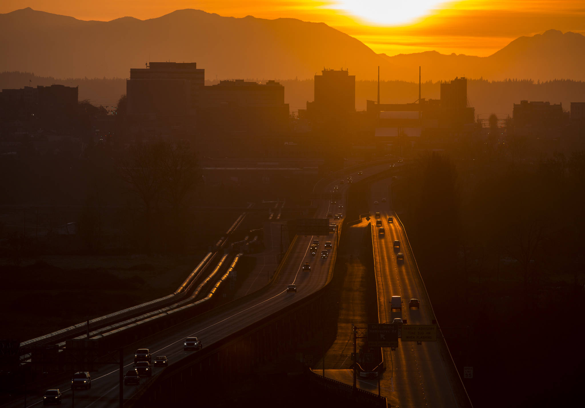 A steady flow of traffic moves along U.S. 2 on Saturday after Everett Mayor Cassie Franklin’s stay-home directive on Friday, which was to take effect Monday. (Olivia Vanni / The Herald)