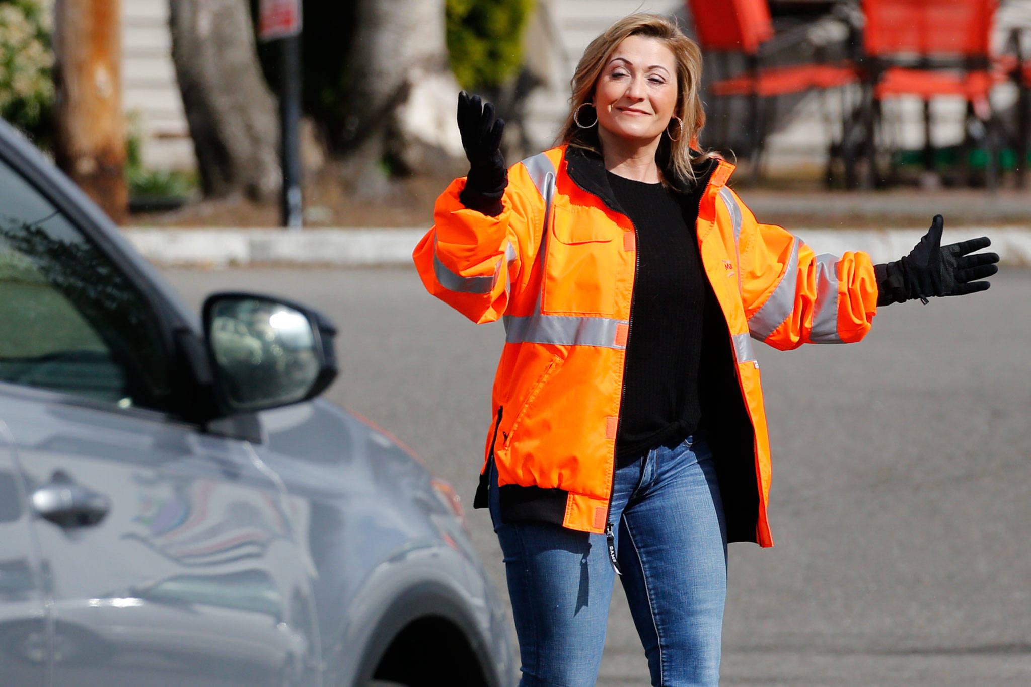 Diana Rose directs traffic Tuesday afternoon at Marysville Community Food Bank. (Kevin Clark / The Herald)