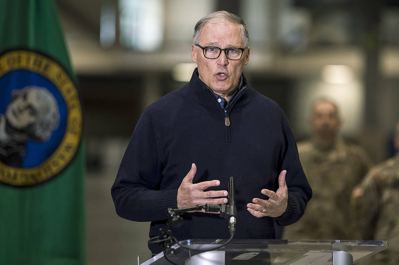 Gov. Jay Inslee discusses the deployment of a field hospital at CenturyLink Field Event Center on Saturday in Seattle. (Amanda Snyder/The Seattle Times via AP, Pool)