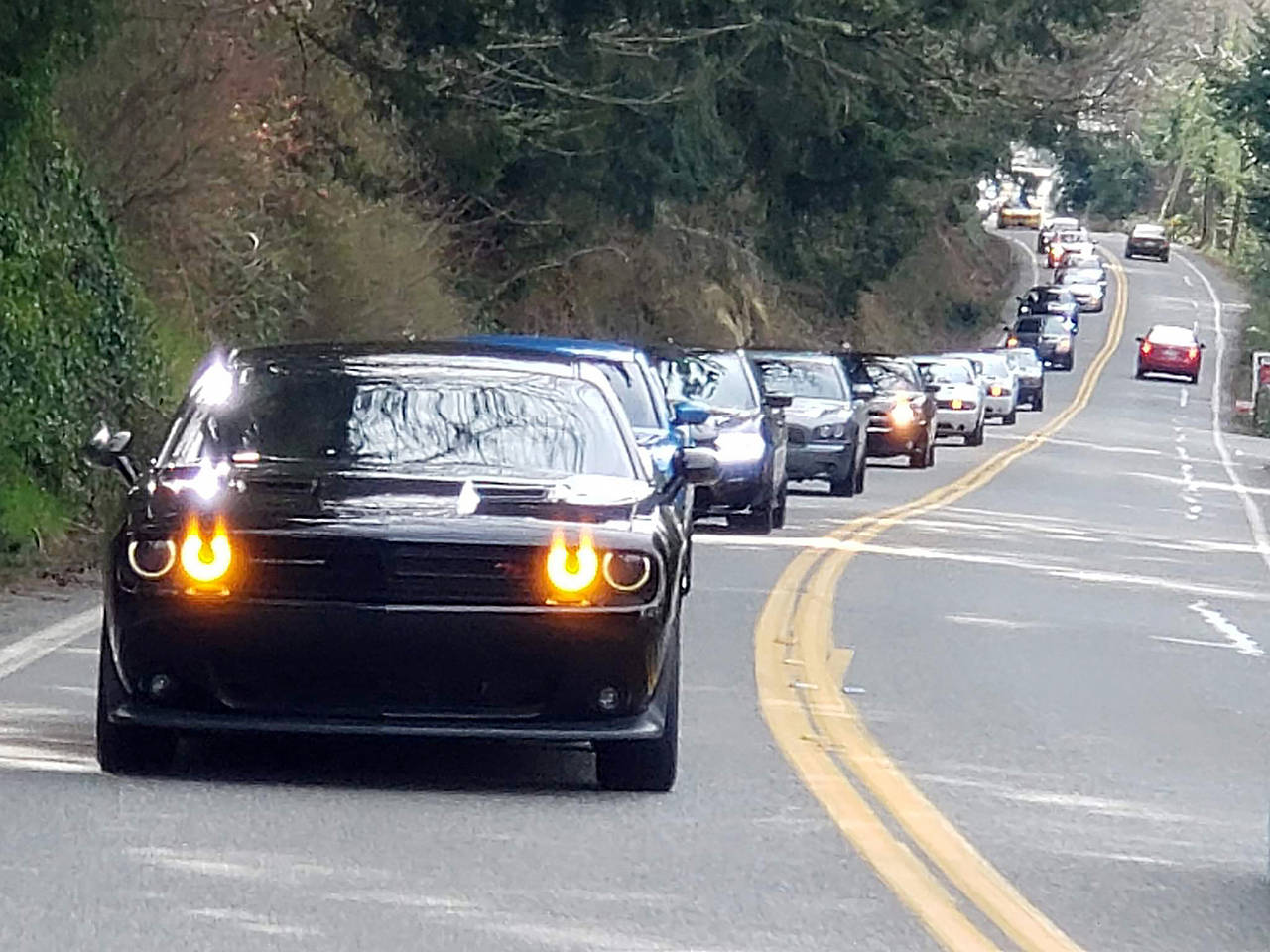 Several members of the Modern Mopars of Snohomish County club motor up Chuckanut Drive during a group cruise in March. It was the club’s last organized gathering before the governor’s order for people to stay home. (Modern Mopars of Snohomish County)