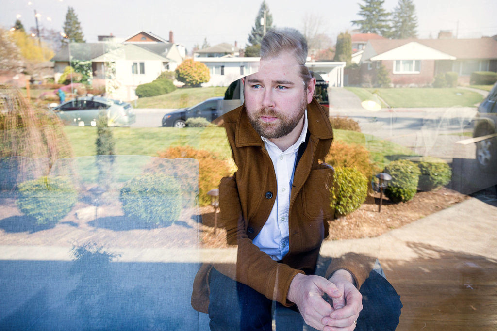 Tyler Chism was diagnosed with COVID-19 and is currently cleared, by CDC standards, but chooses to remain indoors at home on March 20 in Everett. (Andy Bronson / The Herald)
