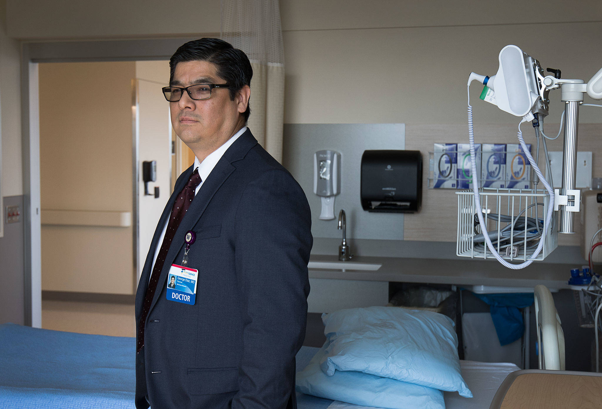 Providence Regional Medical Center’s Dr. George Diaz, who saw the first patient with COVID-19 to be brought to the hospital, in the newest wing of PRMC on Wednesday in Everett. (Andy Bronson / The Herald)