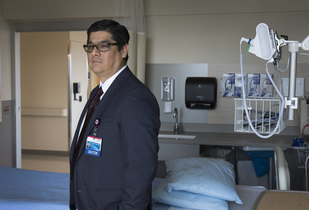 Providence Regional Medical Center’s Dr. George Diaz, who saw the first patient with COVID-19 to be brought to the hospital, in the newest wing of PRMC on Wednesday in Everett. (Andy Bronson / The Herald)
