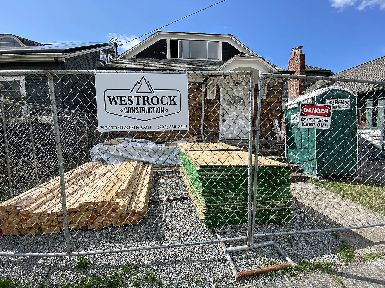 A residential construction project along Rucker Ave. in Everett remains closed down on Wednesday. (Sue Misao / The Herald)