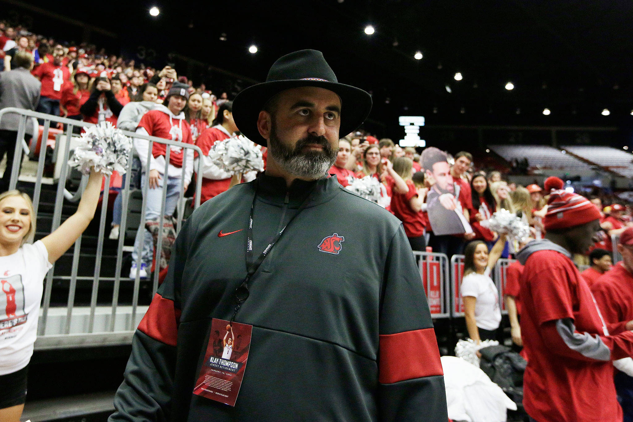 Washington State football head coach Nick Rolovich walks along the court before a college basketball game between Washington State and Oregon State on Jan. 18 in Pullman. (Young Kwak / Associated Press)