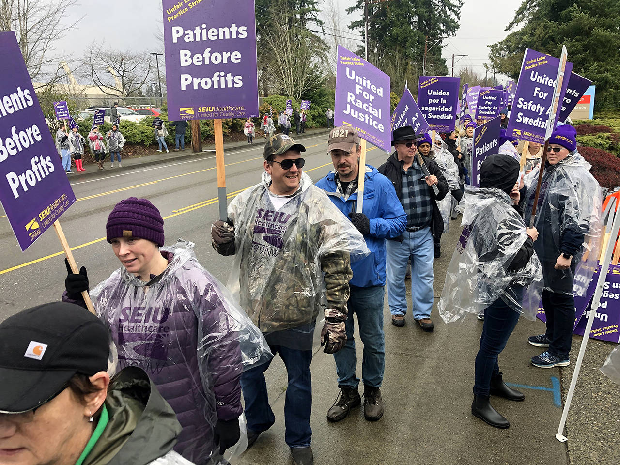 Striking nurses and caregivers at Swedish Edmonds form the picket line outside the hospital in January. (Andy Bronson / Herald file)