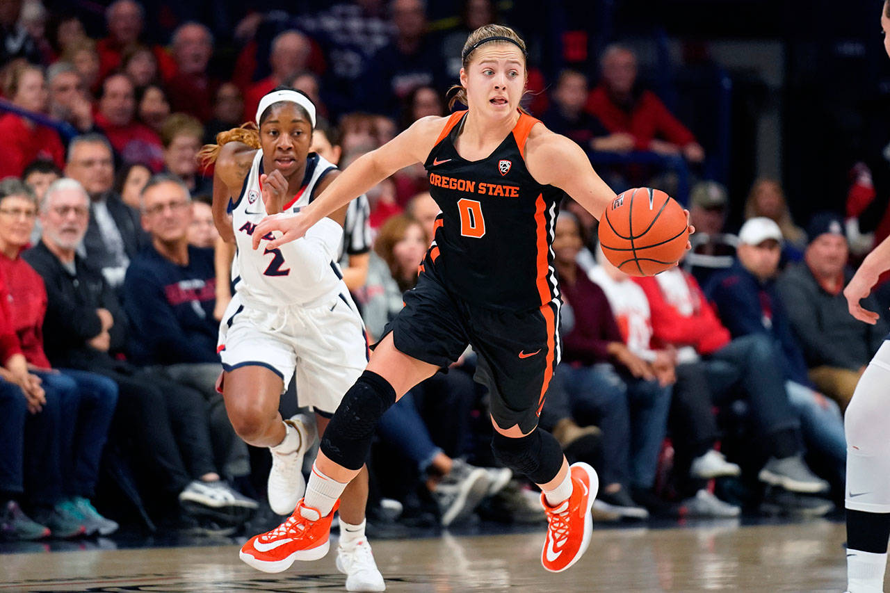 Oregon State guard Mikayla Pivec (0), a Lynnwood High School alum, dribbles up the court during the second half of a game against Arizona on Jan. 10, 2020, in Tucson, Ariz. (AP Photo/Rick Scuteri)