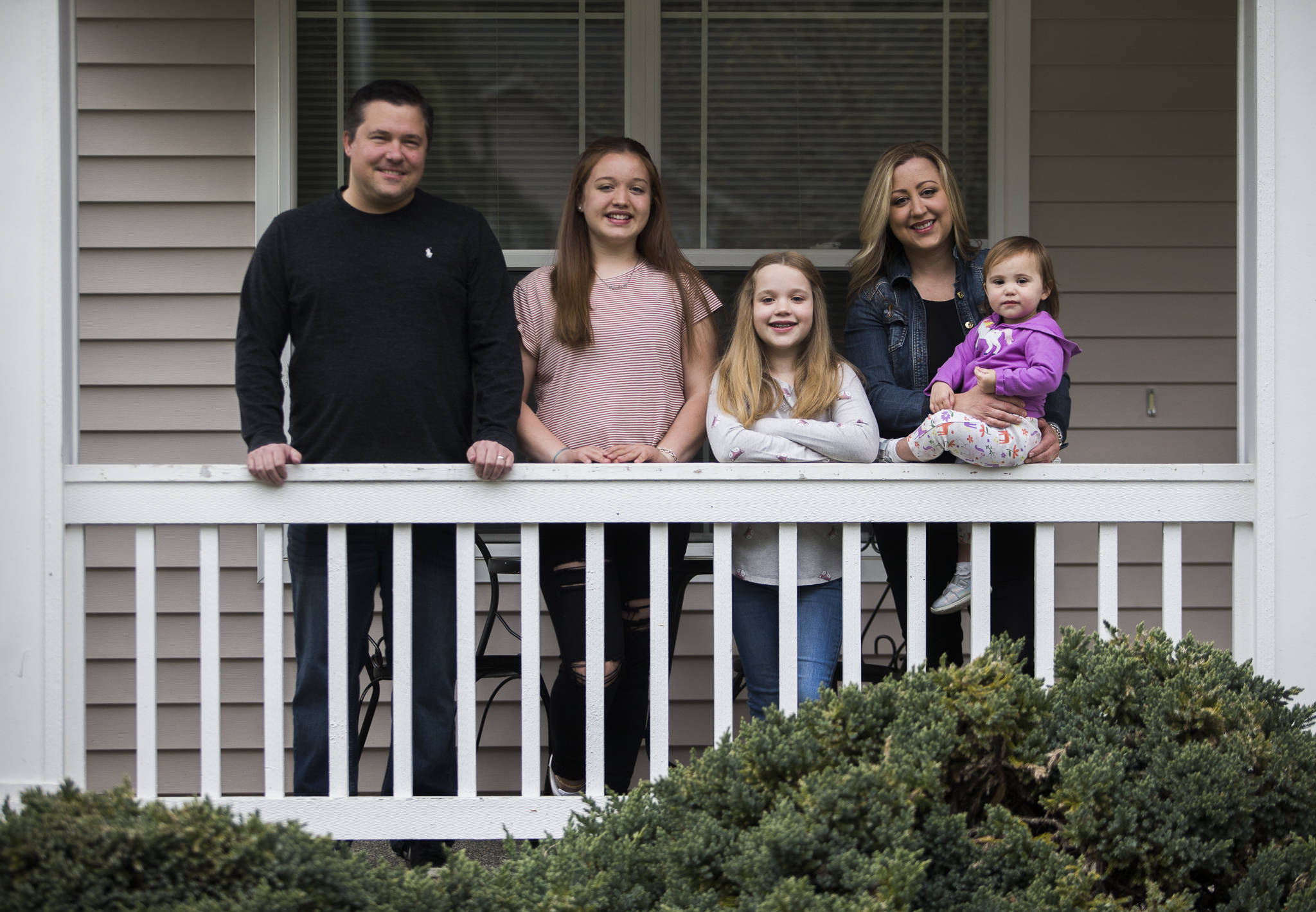 From left: Kris Baier, Kendall Wright, 14, Julia Wright, 9, Kristan Baier and Lily Baier, 1, outside their home in Everett. (Olivia Vanni / The Herald)