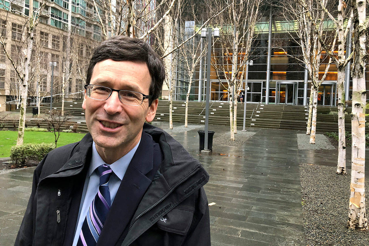 Washington Attorney General Bob Ferguson is shown leaving the U.S. District Court in Seattle on Jan. 23, following arguments in his lawsuit challenging the Trump administration’s funding of the wall on the U.S.-Mexico border. Now he is suing Greyhound for its practice of conducting immigration searches on buses. (AP Photo/Gene Johnson, file)