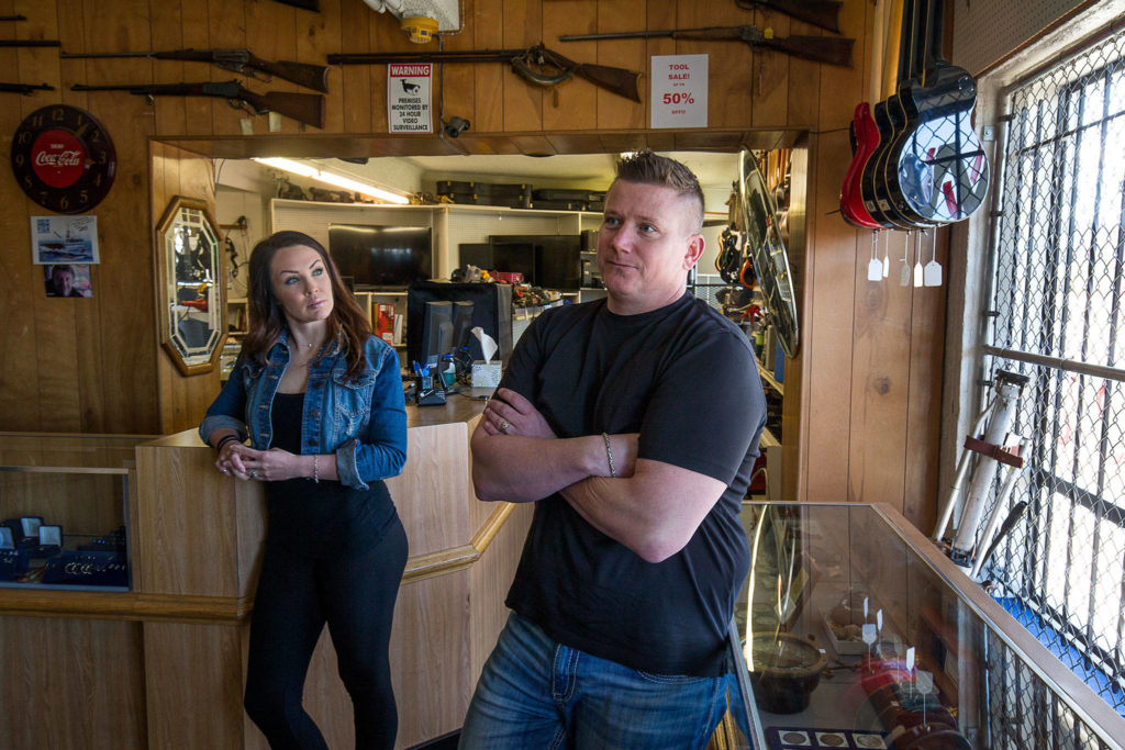 Jerry DuRuz III, third-generation owner of Jerry’s Jewelry & Loans pawn shop, with his wife, Coley, at the store on Highway 99 in Lynnwood. (Andy Bronson / The Herald)
